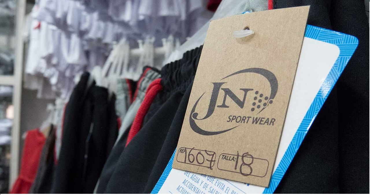 Etiqueta de control de calidad en prendas deportivas JN Sport Wear